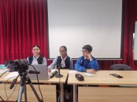 SEK debaters taking notes during their opponent's presentation